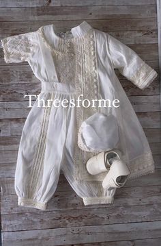 Classic christening outfit, our rompers are great for hot weather. Elegant 6 piece christening outfit soft Poly-Shantung silk , inside fully lined for fresh comfort. Include quarter sleeve shirt full of hand stitched details with back button closure. Beautifully decorated collar. Romper pants are long to the ankle, wide style fit pants with elastic waistband for better fit. Easy button opening on romper from inside ankle. Removable long sleeve jacket with hand decorated lace. Matching hat with h Elegant Sets For First Communion In Summer, Elegant First Communion Sets For Summer, Elegant Summer Sets For First Communion, Off White Baptism Dress For Summer, Cream Sets For Baptism In Summer, Classic Cream Baptism Clothing Set, Classic Cream Baptism Dress, Elegant Cream Sets For First Communion, Classic Cream Sets For Baptism