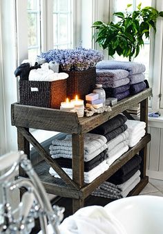 a wooden cart filled with lots of towels