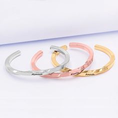 Our personalized twisted engraved stainless steel cuff bangle is a beautiful handcrafted from hammered Stainless Steel with a delicate twist style . The design is simple beautiful and elegant. This year more than ever you need the perfect gift for a birthday, your Bridesmaids or any occasion. It can be personalized with names, dates or a special message engraved on the front. It's available in silver tone, gold tone and rose gold tone. + Material - Stainless Steel.+ Weight - 22.9 g.+ Thickness - Monogrammed Cufflinks, Leather Kits, Swarovski Heart, Twisted Bracelet, Crown Necklace, Name Earrings, Twist Style, Engraved Stainless Steel, Diffuser Necklace