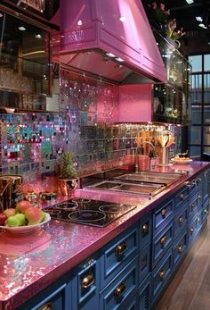 a kitchen with blue cabinets and pink counter tops is seen in this image from the inside