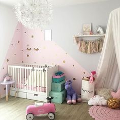 a baby's room with pink and gold decor, including a crib, toys and other accessories