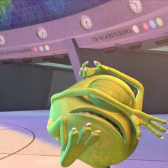 an animated frog is sitting on the floor in front of a basketball court with clocks