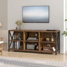 a living room scene with focus on the television and bookshelf in the center