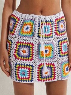 a close up of a person wearing shorts with crochet on the bottom and side