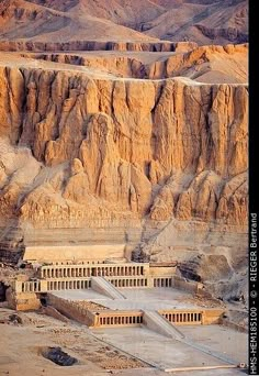 an aerial view of the ancient city of philaeon in egypt, with mountains in the background