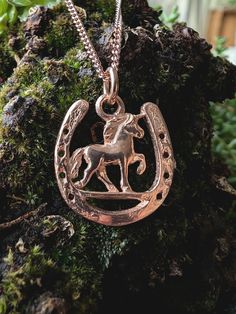 A mythical good-luck charm: the unicorn Lukki stands for freedom and strength. This fusion of horseshoe and unicorn is a toDo Lukki has a width of 1.9cm, a height of 2.1cm and a depth of 2mm. The pendant is made of solid sterling silver and then gold plated. The entire Fine Fellows collection can be found at: fine-fellows.com Horse Design Round Pendant Necklace As Gift, Horse Design Round Pendant Necklace For Gift, Round Pendant Necklace With Horse Design For Gift, Horse Design Pendant Jewelry Gift, Gold Horseshoe Charm Necklace As Gift, Horseshoe Shaped Engraved Jewelry Gift, Gold Horseshoe Charm Necklaces As Gift, Gold Horseshoe Charm Necklace For Gift, Engraved Horseshoe Jewelry Gift