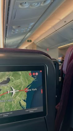 an airplane with a map on the screen