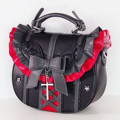 This adorable crossbody bag is versatile and matches well with many coords, including gothic lolita style and punk alternative outfits. It's also wonderful to use as a cosplay accessory to rep your favourite character, or as a day to day bag. It features a classic colour palette of black and red, has the cutest little demon wings and is loosely inspired by Utau's Lunatic Charm transformation. It can carry many essentials including your phone, an average sized wallet and most smaller sized items. Kawaii Purse, Gothic Purse, Gothic Bag, Everyday Cosplay, Classic Color Palette, Punk Accessories, Quality Handbags, Cute Purses, Alternative Outfits