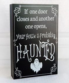 a sign that says if door closes and another one opens, your house is probably haunted