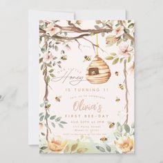 a baby shower card with a beehive hanging from a tree branch and flowers