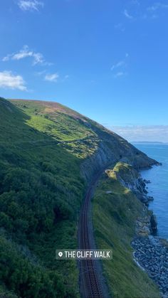 an aerial view of a train track near the ocean