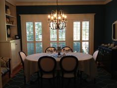 the dining room table is set with four chairs and two place settings for six people