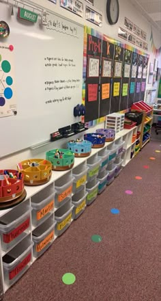 a classroom filled with lots of different colored bins