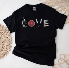 a black t - shirt with the word love on it