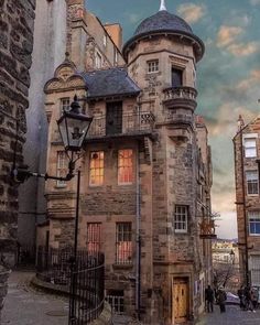 an old stone building with a clock tower