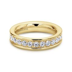 a yellow gold wedding band with channeled diamonds