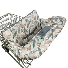 a shopping cart with a seat cover on it's front and back wheels attached to the side