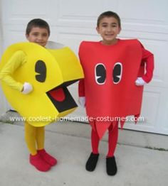 two children dressed up in costumes standing next to each other, one holding a banana and the other wearing a costume