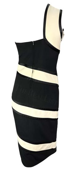 For Sale on 1stDibs - TheRealList presents: a black and white Valentino mini dress. From the Spring/Summer 1993 collection, this dress debuted on the season's runway on Katoucha Dress With Bow, Valentino Garavani, White Stripe, Day Dresses, Spring Summer, Mini Dress, Black And White, White, Dresses