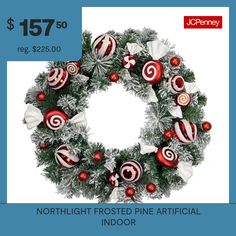 a christmas wreath with red and white ornaments is on sale for $ 75 00 reg $ 250 00