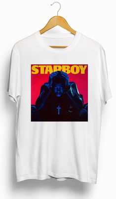 This is a custom The Weeknd Starboy | Custom T-Shirt. Please view photos for size chart. Message us for custom colors or styles. Features • 5.3 oz., 100% preshrunk cotton • Double-needle sleeve and bottom hems •Taped neck and shoulders•Classic midweight fabric•Classic fit tubular body •7/8" collar•Classic fit•Tear-away labelCare:Machine wash cold inside out. Hang dry or low dry. Never iron directly on graphic. Starboy Album Cover, The Weeknd Starboy, Weeknd Starboy, Weekend Sweatshirt, T Shirt Logo Design, Shirt Logo Design, Tee Shirt Designs, Clothes Women, Tee Outfit