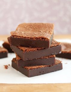 chocolate brownies stacked on top of each other