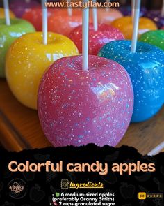 colorful candy apples are on display with candles in the middle and black text that reads, colorful candy apples