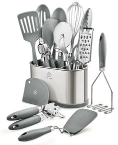 an assortment of kitchen utensils in a metal container