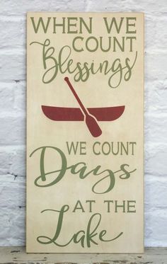 a sign that says when we count blessings, we count days at the lake