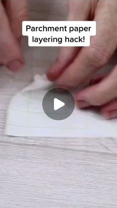 someone is wrapping paper on top of a piece of white wood with the words parchment paper layering hack