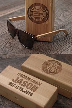 two wooden boxes with sunglasses on them sitting on a table next to a pair of glasses