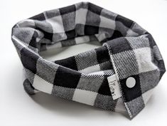 Keep your little one warm and stylish this winter with this easy to put on and take off infinity scarf! This scarf is appropriate for 4 months + (up to approximately 5 years old). Parents and guardians can easily put on and take off this scarf without pulling it over your little one's head as they come with two sets of snap fasteners for easy access. The soft flannel material ensures your child stays warm as you can fold it in half lengthwise or scrunch up the fabric to create multiple layers. O Flannel Scarf Kids, Black And White Flannel Scarf, Flannel Scarf, Flannel Scarves, Buffalo Plaid Flannel, Black And White Plaid, Snap Fasteners, Scarf Gift, Flannel Material