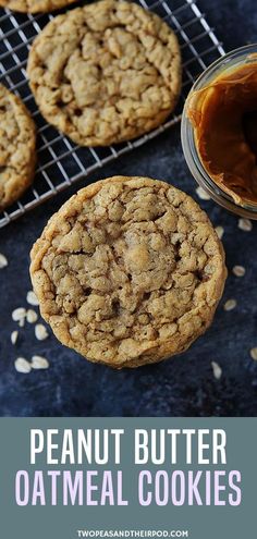 peanut butter oatmeal cookies are cooling on a rack and next to a jar of peanut butter