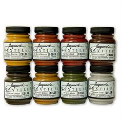 twelve different colors of acrylic paint in jars on a white background with the words,