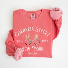 Our Cornelia Street New York sweatshirts are cute and cozy, perfect for spring and great for gifting. Luxurious comfort and style are what this vintage style, garment-dyed sweatshirt is all about. It's made with 80% ring-spun cotton and 20% polyester and the fabric is 3-end garment-dyed, ring-spun, color-blast fleece with a 100% cotton face. Each sweatshirt comes with a relaxed fit, a rolled-forward shoulder, and a back neck patch.  .: 80% ring-spun cotton, 20% polyester .: Medium-heavy fabric ( Cozy Graphic Print Sweatshirt For Spring, Cozy Fit Letter Print Sweatshirt For Spring, Comfortable Graphic Print Sweatshirt, Comfortable Fit Graphic Print Sweatshirt, New York Crewneck, Cornelia Street, Spring Sweatshirt, New York Sweatshirt, Dyed Sweatshirt