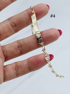 Style 1 - Mis 15 Años  Real 10k Gold Bracelet Mis 15 Años/ sweet 15  ❤️ This is a 7" long bracelet  ❤️ Dainty bracelet  ❤️ 2.6mm wide  ❤️ Yellow gold  ❤️ Small box included  Estilo 1 - Mis 15 Años  ❤️ Pulsera de 10 kilates en oro  ❤️ Mide 7 pulgadas de largo y 2.6 milímetros de ancho  ❤️ Oro dorado ❤️ Pulsera con mis 15 años ❤️ Quinceañera  ❤️ Pulso eslabon liviano finito   Stock #031963 ------------ Style 2 - 15 Años  Real 10k Gold Bracelet Mis 15 Años/ sweet 15  ❤️ This is a 7" long bracelet  ❤️ Dainty bracelet  ❤️ 2.6mm wide  ❤️ Yellow gold  ❤️ Small box included  Estilo 2 - 15 Años  ❤️ Pulsera de 10 kilates en oro  ❤️ Mide 7 pulgadas de largo y 2.5 milímetros de ancho  ❤️ Oro dorado ❤️ Pulsera con mis 15 años ❤️ Quinceañera  ❤️ Pulso eslabon liviano finito   Stock #072313  ------------ Elegant Gold Jewelry For Sweet 16, Personalized Elegant Jewelry For Sweet 16, 14k Gold Bracelet For Birthday, Personalized Yellow Gold Jewelry For Sweet 16, Gold Wedding Name Bracelet In 14k, Gold Arm Band, 15 Rings, Long Bracelet, Gold Color Ring