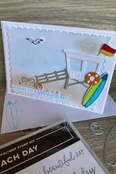 some cards are laying on top of each other and one has a surfboard in it