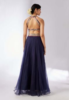 This elegant navy blue lehenga set features a chic halter-neck choli adorned with intricate floral embroidery, paired with a matching flowy skirt. The ensemble is completed by a beautifully embroidered dupatta, making it an ideal choice for festive celebrations and traditional events. Anarkali Lehenga With Dori Work For Evening, Party Lehenga With Dori Work Maxi Length, Evening Lehenga With Dori Work, Evening Floor-length Lehenga With Dori Work, Navy Blue Lehenga, Indian Arts And Crafts, Blue Lehenga, Indian Textiles, Embroidered Dupatta