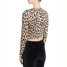 Alice + Olivia "Delaina" top in leopard-print. Crew neckline. Long sleeves. Fitted silhouette. Cropped hem. Pullover style. Viscose/spandex. Imported. Cocktail Jacket, Feminine Aesthetic, Mesh Long Sleeve, Fitted Silhouette, Alice Olivia, Sweater Skirt, Pullover Styling, Crew Neckline, Crop Tops Women