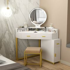 a white vanity table with a mirror and stool