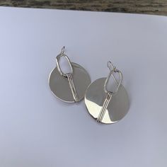 I handcraft these Circle with Lines earrings from sterling silver and add a shiny finish or Shiny with a hand textured accent. Please let me know in notes at checkout if you prefer them with hand texture Measures: @1.25" width Material: Silver (.925). All materials are hypoallergenic. These Earrings are designed and handcrafted in my studio in Concord, NH Silver Minimalist Earrings With Polished Finish, Minimalist Sterling Silver Earrings With Polished Finish, Minimalist Polished Silver Earrings, Silver Minimalist Polished Earrings, Minimalist Polished Sterling Silver Earrings, Sterling Silver Round Earrings With Polished Finish, Sterling Silver Earrings With Polished Finish For Everyday, Sterling Silver Polished Earrings For Everyday, Polished Sterling Silver Earrings