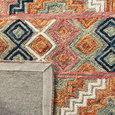 an area rug with different colors and patterns