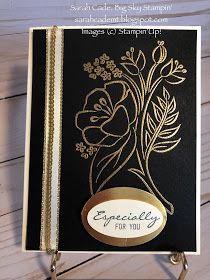 a black and gold greeting card with flowers on the front, says specialty for you