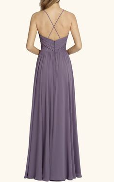 a woman in a long purple dress looking back at the camera with her hands on her hips