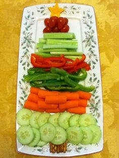 vegetables arranged in the shape of a pyramid on a plate