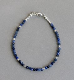 "Sodalite Bracelet Blue Gemstone Bracelet Beaded Gemstone Bracelet Sodalite Gemstone Bracelet Beautiful Natural Sodalite Faceted Round gemstone beads along with sparkling Hill tribe silver seed beads make a lovely bracelet that looks great alone or stacked with others. The Sodalite gemstones have many lovely shades of blue with a nice sparkle to them. (colors are not as vibrant as they show in the photos Each bracelet will be unique as I choose each beach individually to create a pretty mix. The Sodalite Bracelet, Sodalite Jewelry, Blue Gemstone Bracelet, Homemade Bracelets, Gemstone Beads Jewelry, Coral Bracelet, Hill Tribe Silver, Bracelet Blue, Bracelet Gemstone