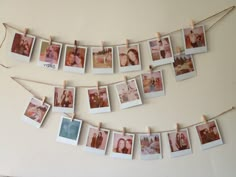 several polaroid photos hung on a string with clothes pins and twine attached to them