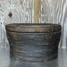 a large woven basket sitting on top of a table