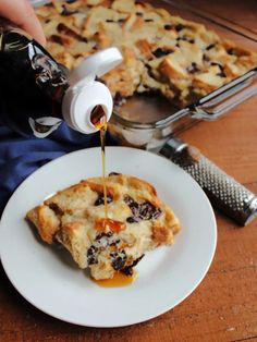 someone is pouring syrup on a piece of pie