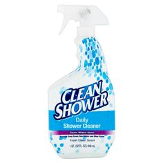 a bottle of clean shower cleaner sitting on top of a white surface with blue dots